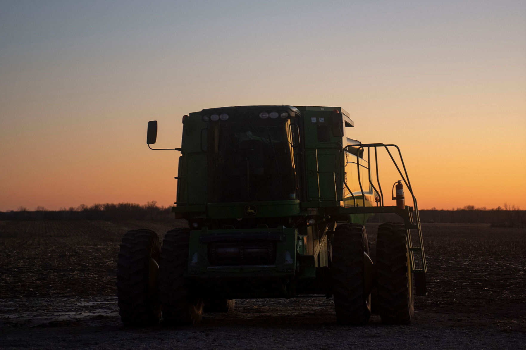 Rusty Reed’s combine sits on the edge of a corn field